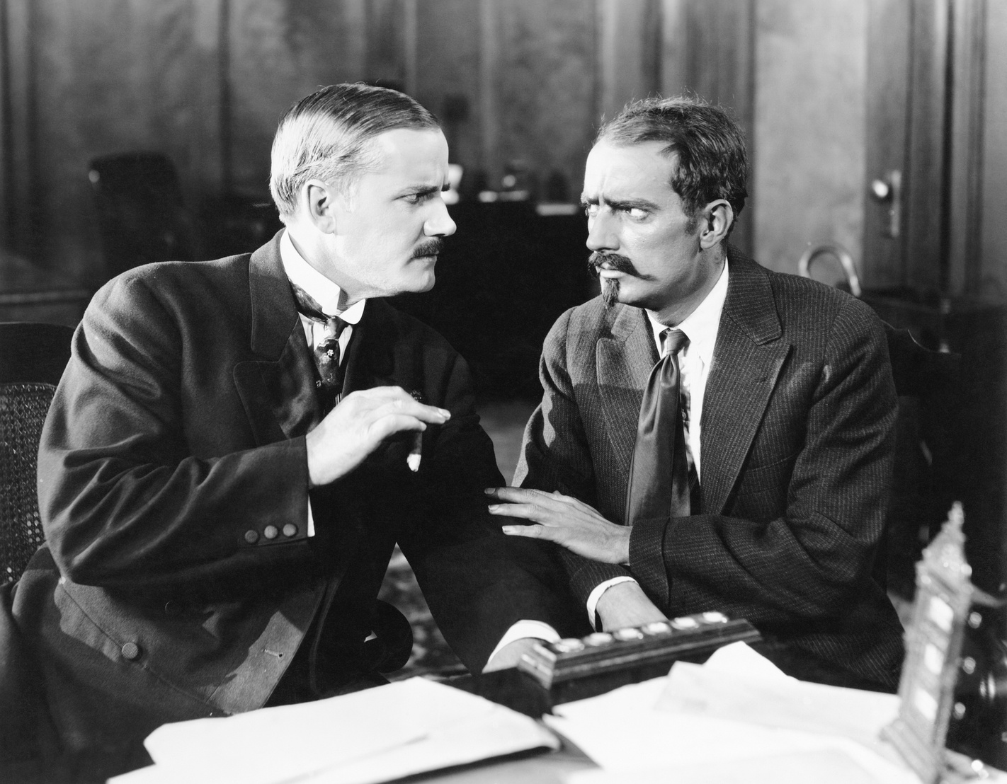 Two men sitting together talking